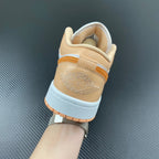 Air Jordan 1 Low sneakers heel view with tan lining and embossed logo detail