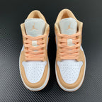Air Jordan 1 Low sneakers pair view with peach laces and tan-and-white uppers