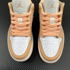 Air Jordan 1 Low sneakers rear view with peach laces, white toe caps, tan overlays