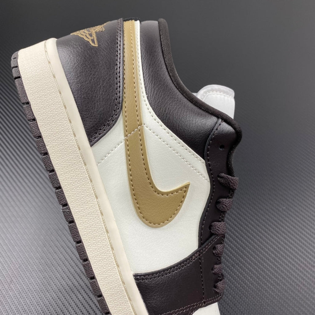 Low-top sneakers with white quarter panel, dark brown leather, and beige swoosh detail