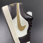 Low-top sneakers with white quarter panel, dark brown leather, and beige swoosh detail