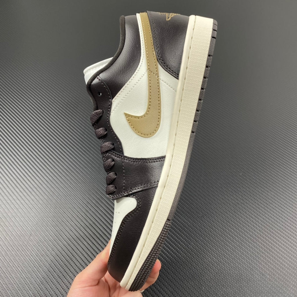 Low-top sneakers in dark brown and white with beige swoosh and padded collar