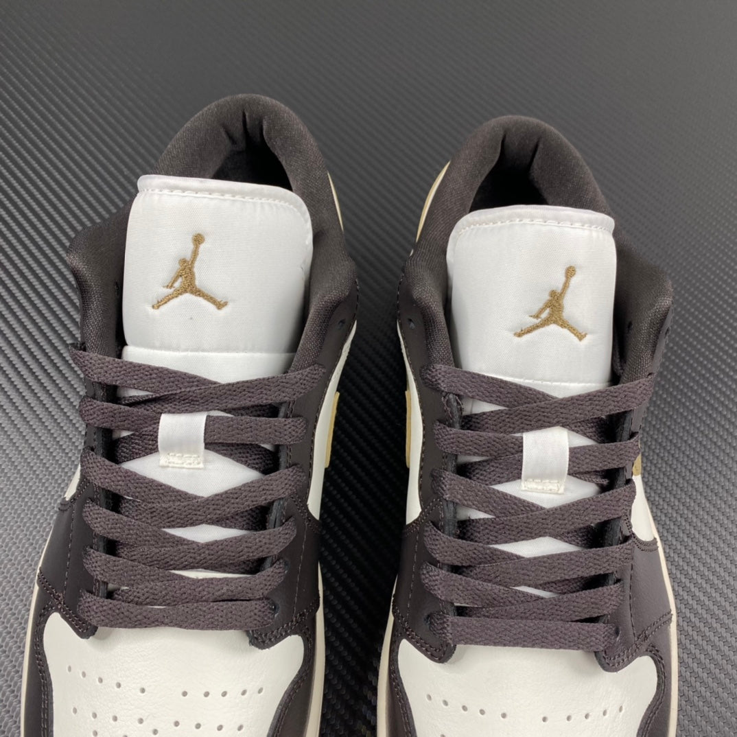 Back view of low-top sneakers with white heel panels and Air Jordan gold logos