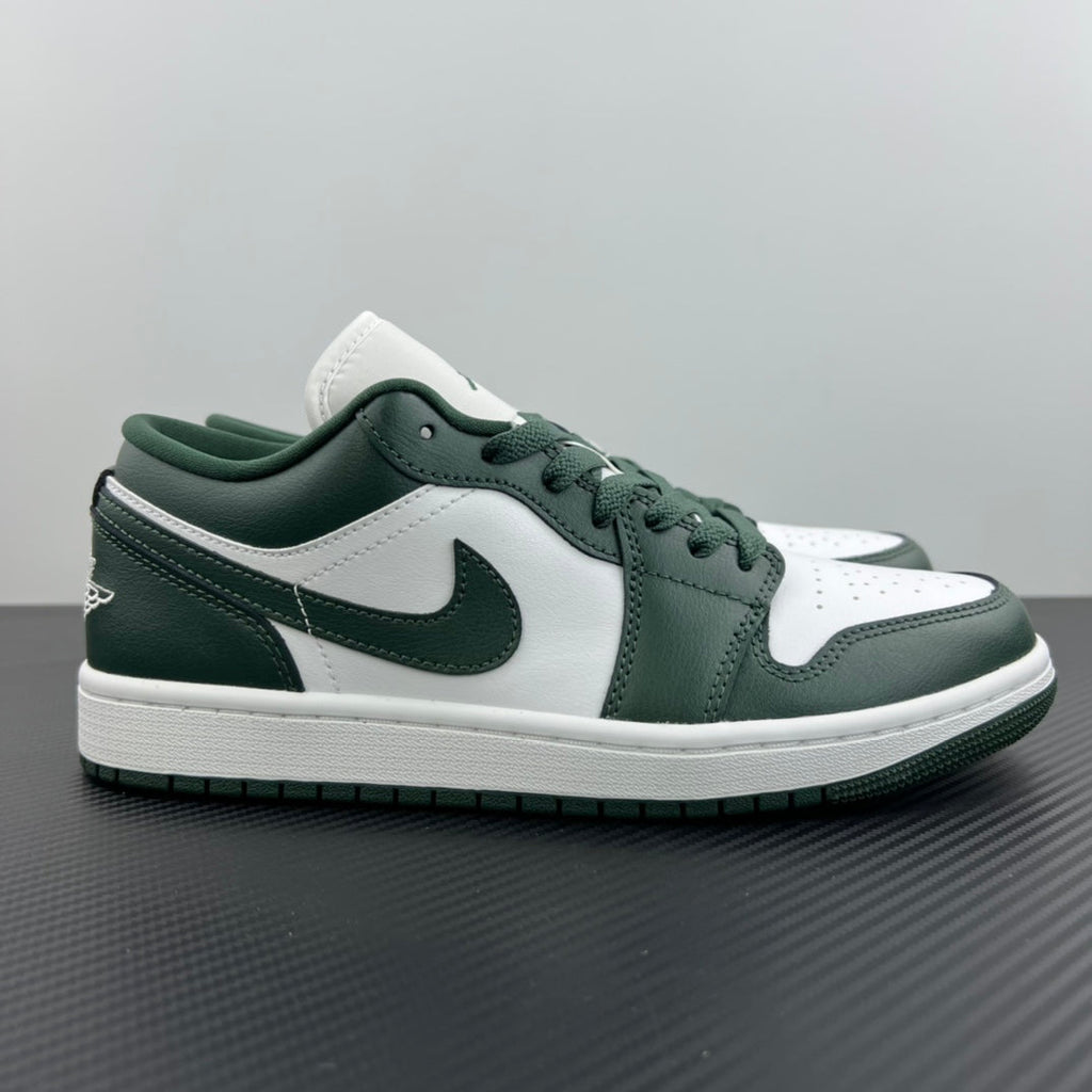 Low-top sneakers with white leather panels and dark green overlays, lace-up design
