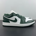 Low-top sneakers with white leather panels and dark green overlays, lace-up design