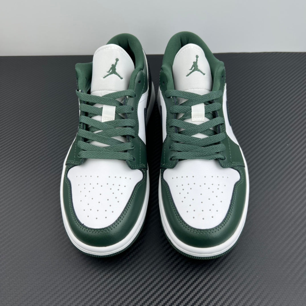 Low-top sneakers front view with white toe box, dark green laces and panels