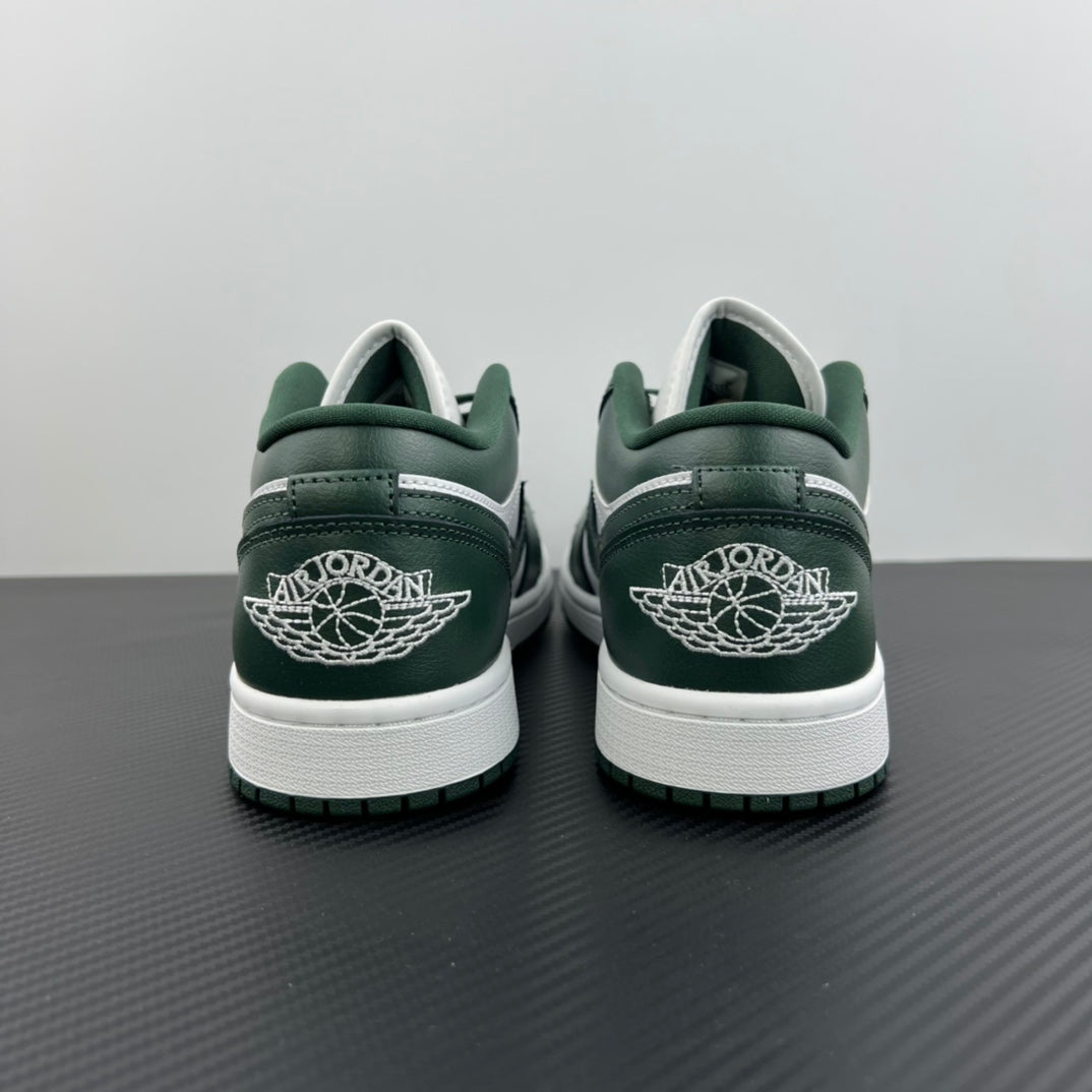 Low-top sneakers back view with dark green heel, white midsole, and Jumpman logo