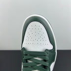 Low-top sneakers toe close-up with perforated white vamp and dark green laces