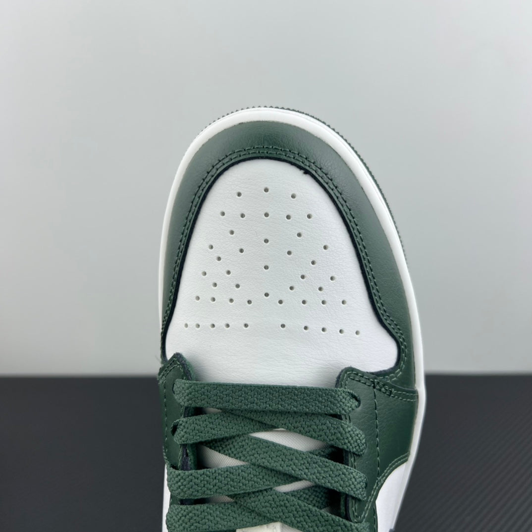 Low-top sneakers toe close-up with perforated white vamp and dark green laces