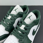 Low-top sneakers angled close-up with dark green swoosh and white quarter panels
