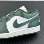 Low-top sneakers quarter close-up with dark green swoosh, white leather, and laces