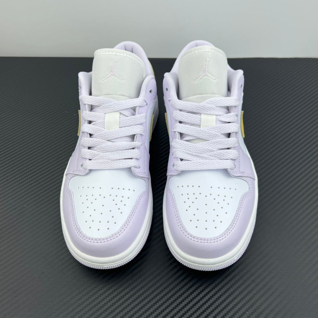 Women’s Air Jordan 1 Low sneakers, back view with light lavender heel tabs and white laces