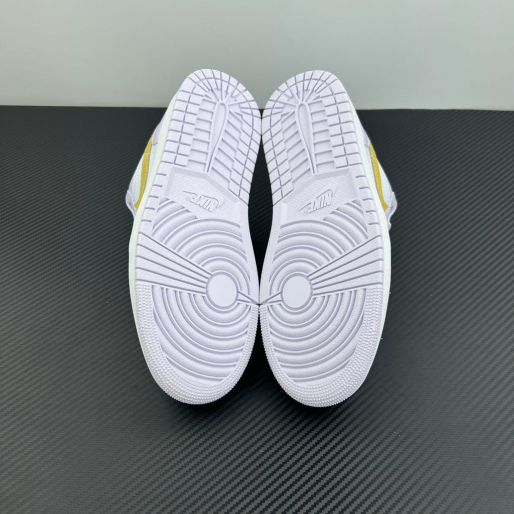 Women’s Air Jordan 1 Low sneakers, double outsole view with circular tread pattern