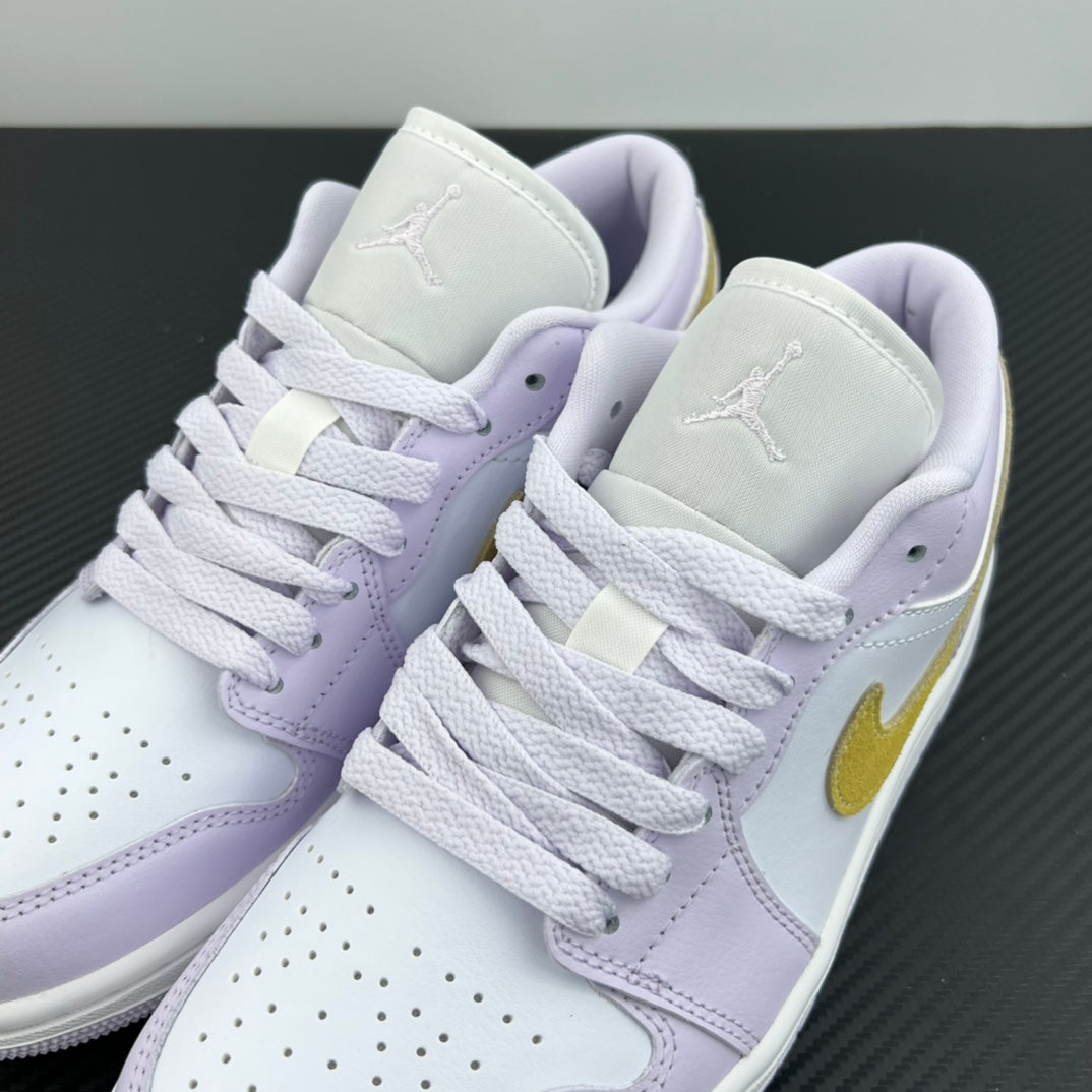 Women’s Air Jordan 1 Low sneakers pair, light lavender uppers with yellow swoosh and white laces