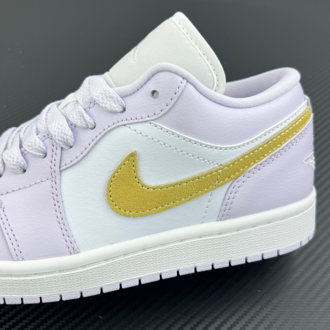 Women’s Air Jordan 1 Low sneaker side close-up with yellow swoosh on light lavender leather