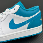 Low-top sneakers side panel close-up, aqua blue Nike swoosh on white leather