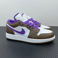 Low-top sneakers with white leather panels, brown overlays, and purple laces