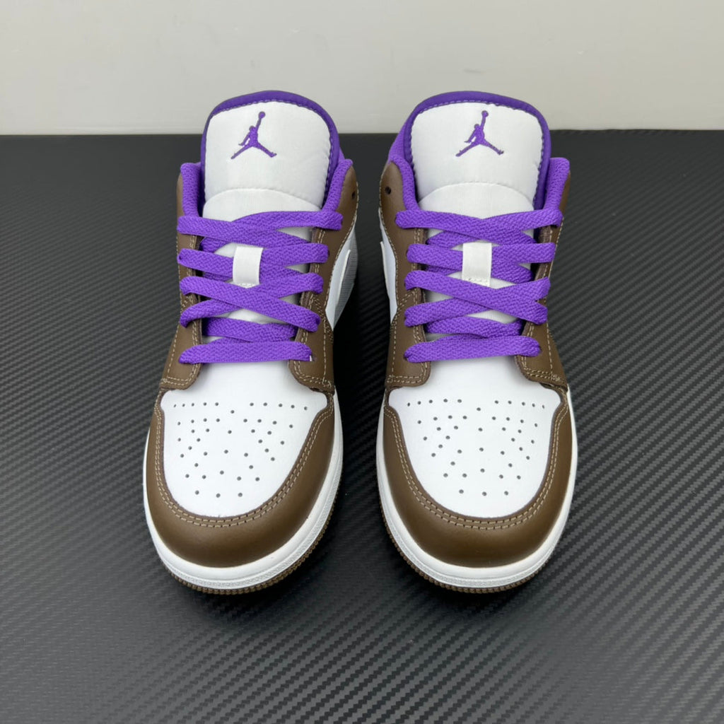 Pair of low-top sneakers with white toe box, brown sides, and purple laces