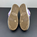 Low-top sneakers showing beige treaded outsoles and purple accents on sides