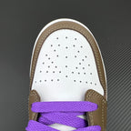 White perforated toe box with brown trim and purple lace strap on low-top sneaker