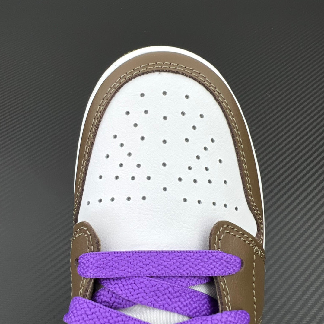White perforated toe box with brown trim and purple lace strap on low-top sneaker