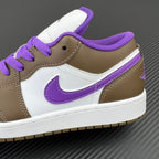 Low-top sneakers with purple Swoosh, brown leather panels, white midsole, and purple laces