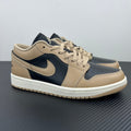 Low-top sneakers in tan and dark navy with Nike swoosh and lace-up.
