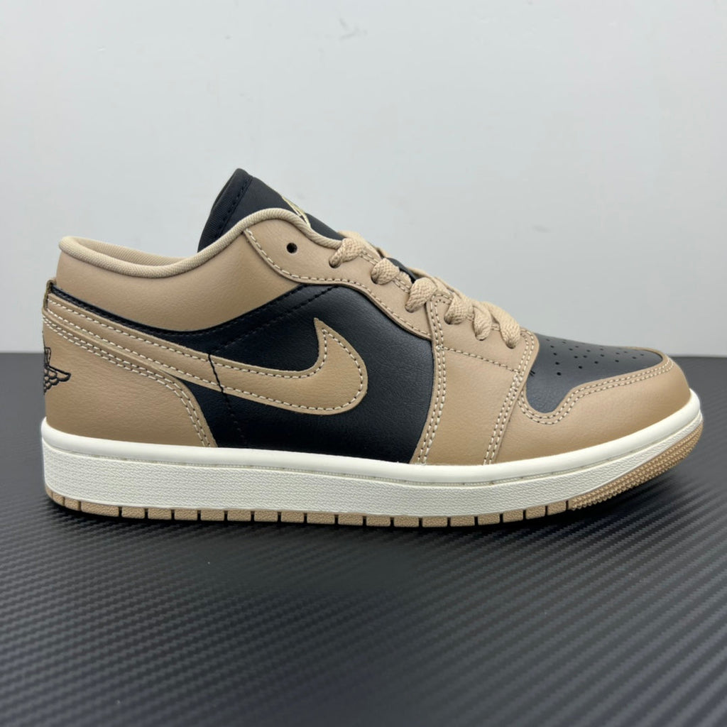 Low-top sneakers, tan upper with dark navy panels, Nike swoosh, lace-up.