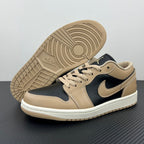 Low-top sneakers with tan rubber outsole and dark navy swoosh, lace-up.