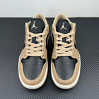 Low-top sneakers pair, tan leather with navy ankle panels, Air Jordan logos.