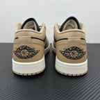 Low-top sneakers heel area, tan leather with navy collar and Air Jordan Wings logo.