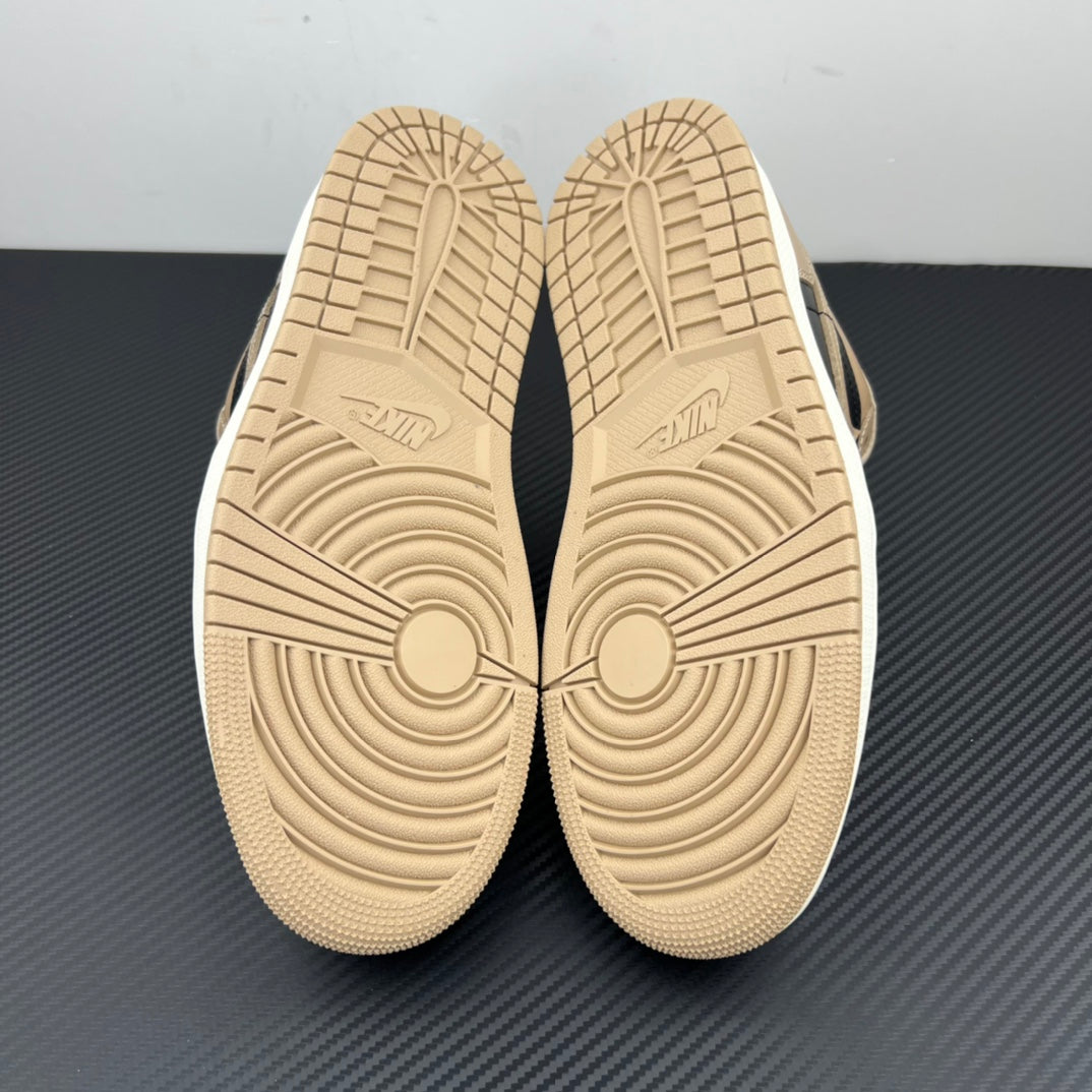 Low-top sneaker outsoles, textured tan rubber with circular traction patterns.