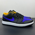 Low-top sneaker with dark upper, purple Swoosh, yellow lining, and white midsole.