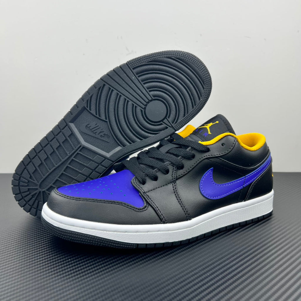 Low-top sneaker with dark leather, purple toe panel, purple Swoosh, white sole.