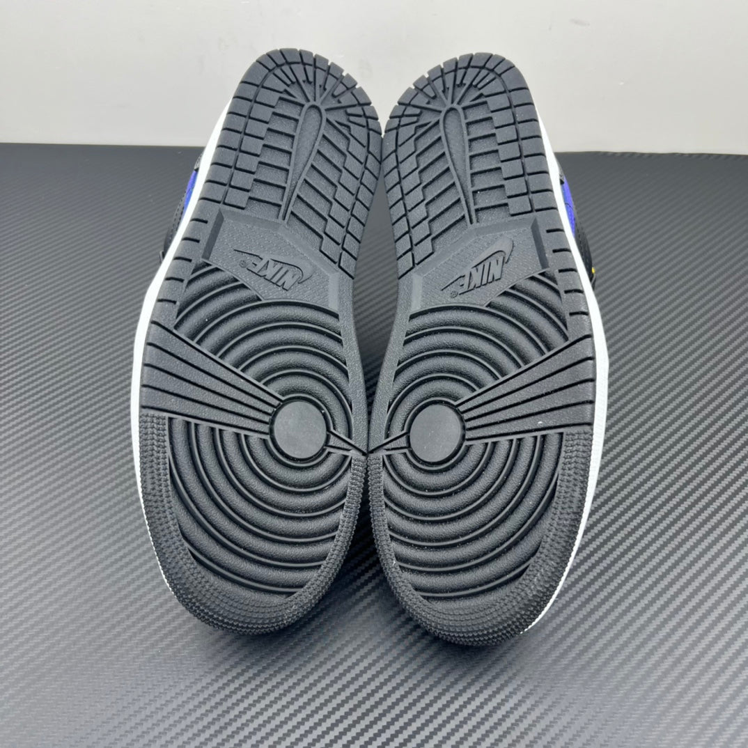Low-top sneaker outsole pair with textured tread and circular traction patterns.