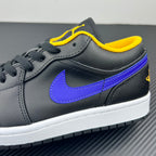 Low-top sneaker quarter view with purple Swoosh, dark leather, yellow collar stitch, white midsole.