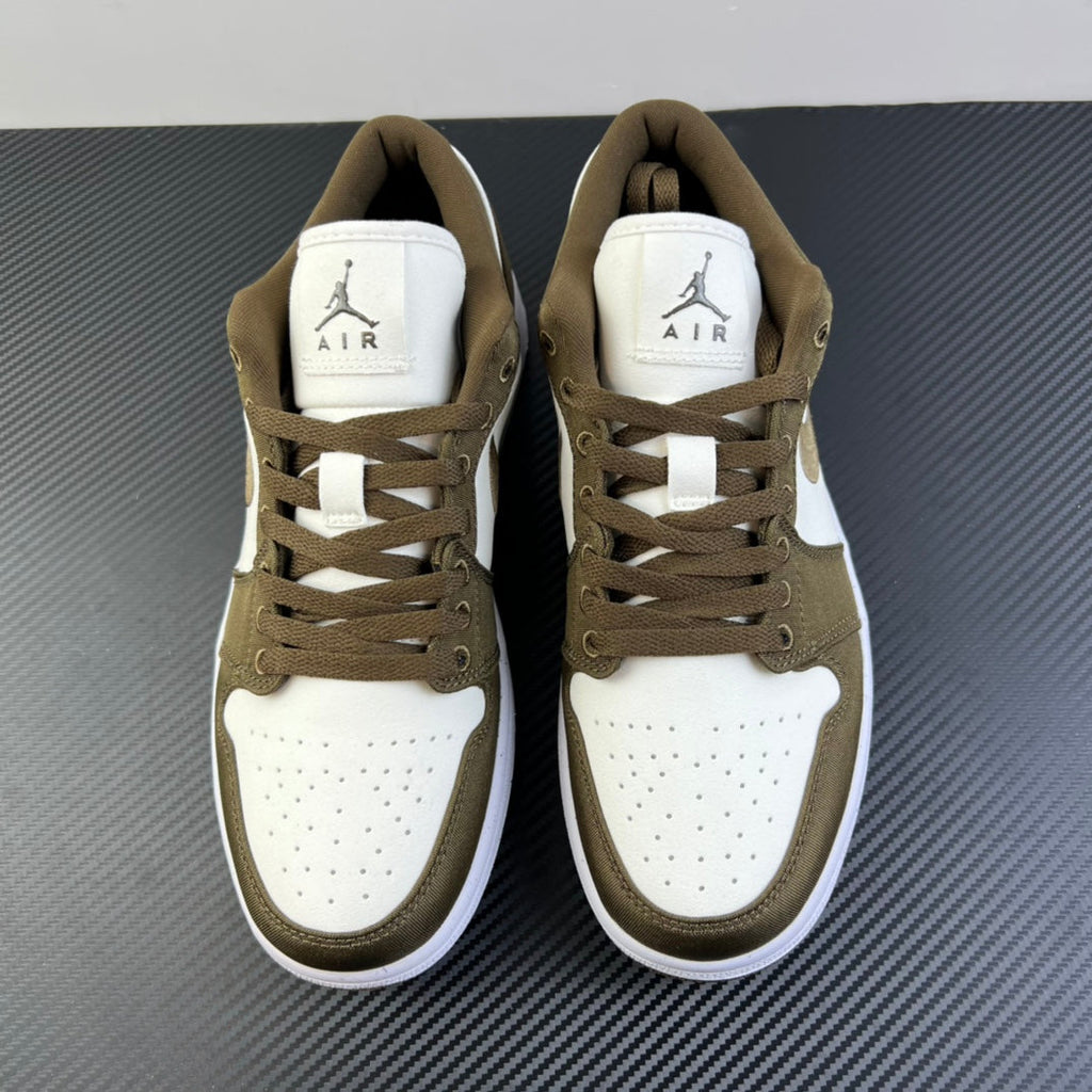 Pair of low-top sneakers in olive and white, lace-up front with Air tongue tag
