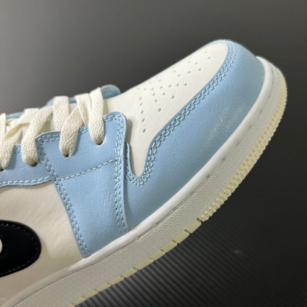 Air Jordan 1 Low ice blue side panel with laces, stitching, and white sole