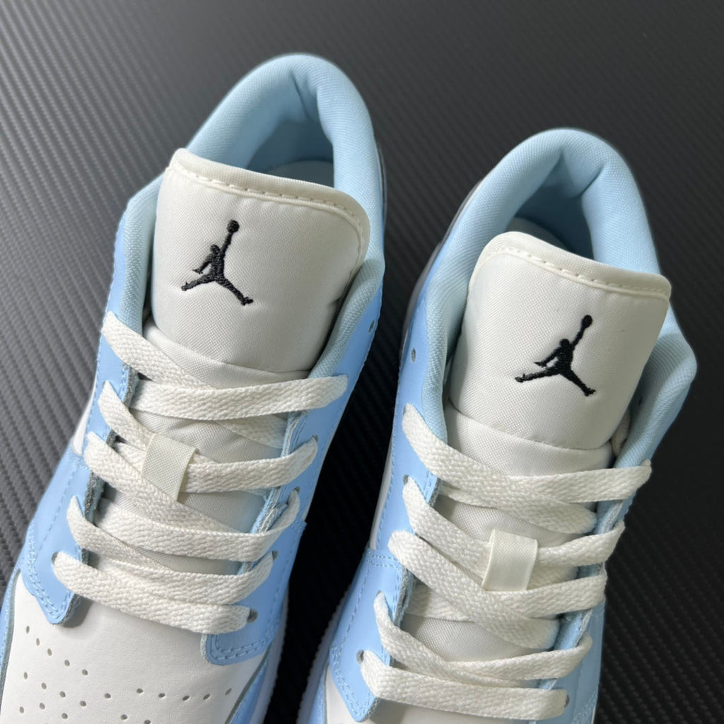 Air Jordan 1 Low heel view with Jumpman logo on white panels and blue lining