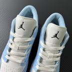 Air Jordan 1 Low heel view with Jumpman logo on white panels and blue lining