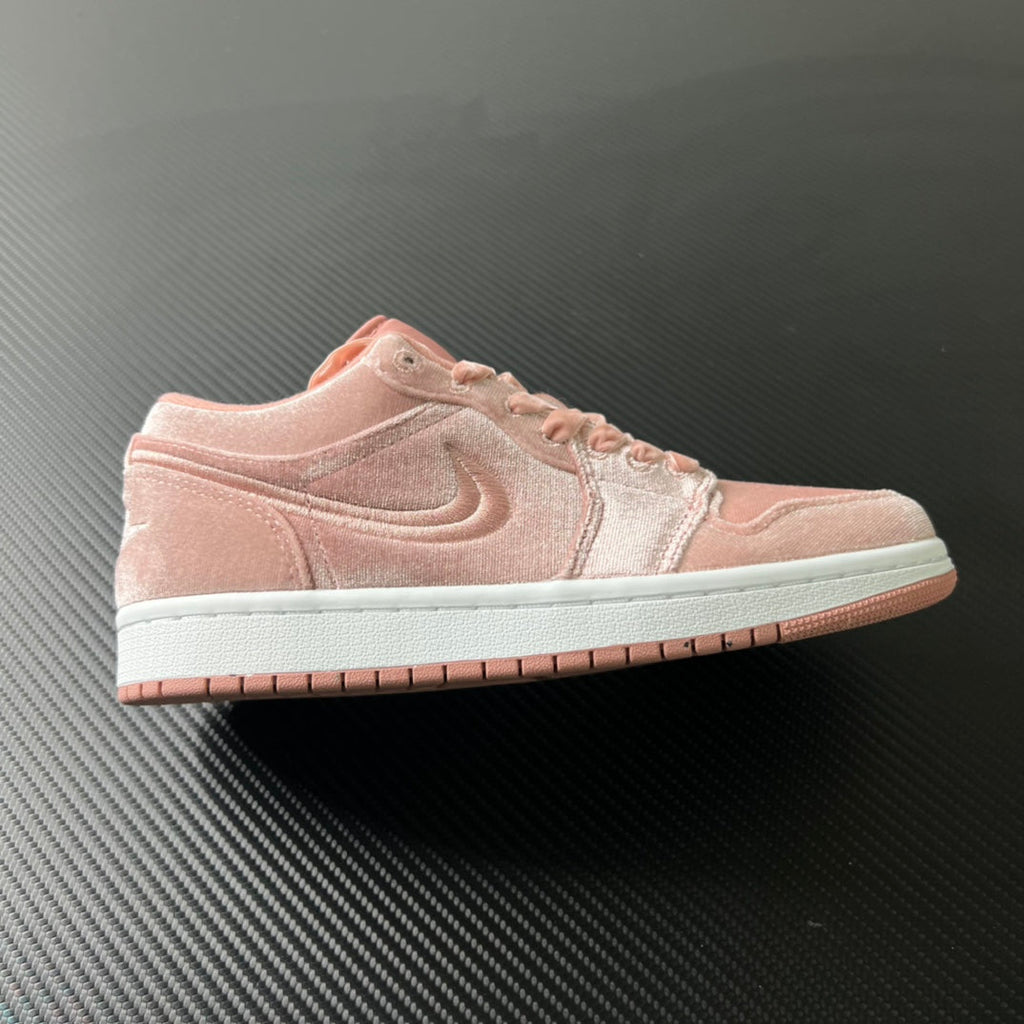 Air Jordan 1 Low pink velvet suede sneakers with white midsole and pink laces