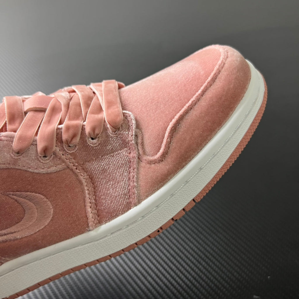 Air Jordan 1 Low pink suede sneakers, side panel and swoosh detail