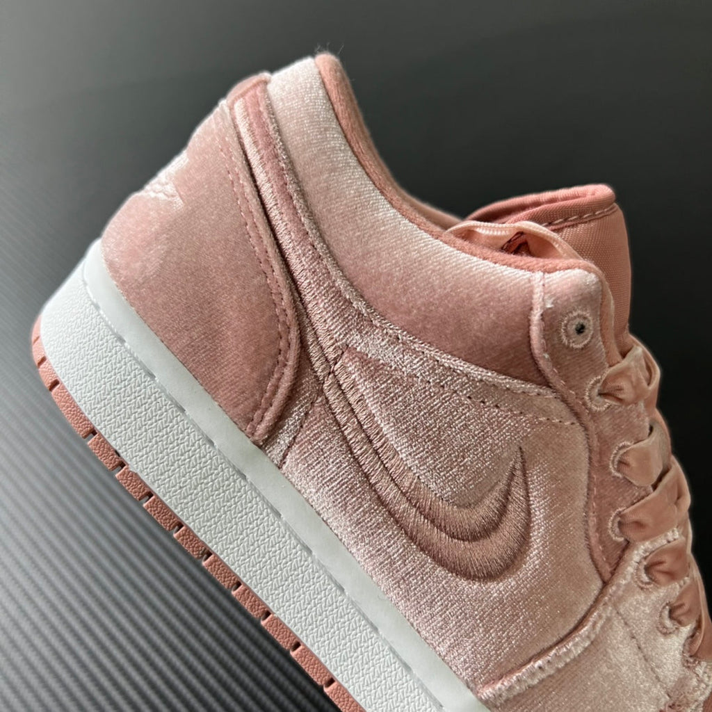 Air Jordan 1 Low pink velvet suede sneakers with swoosh and lace closure