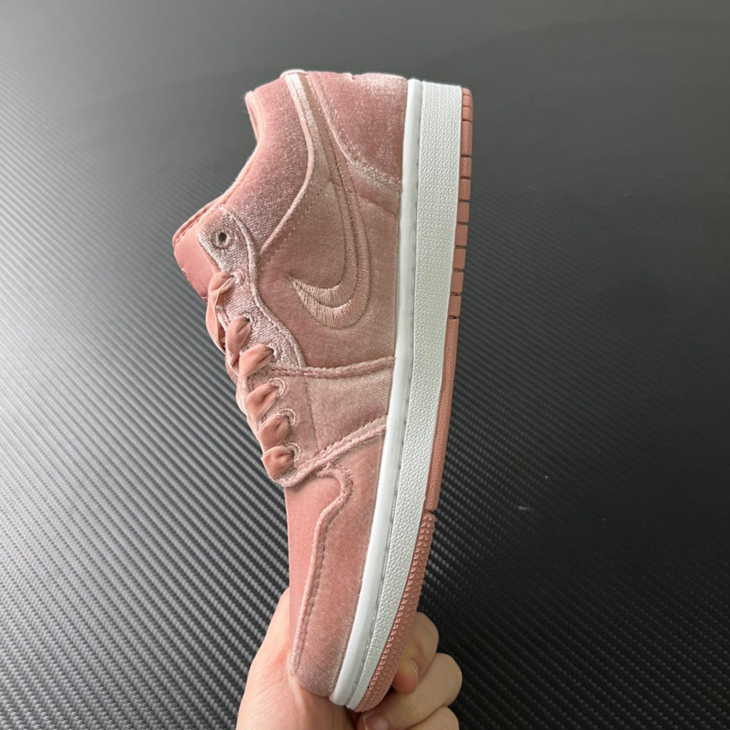 Air Jordan 1 Low pink velvet suede sneakers, quarter view with heel tab