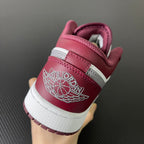 Air Jordan low-top sneakers with bordeaux heel, white midsole, and Wings logo