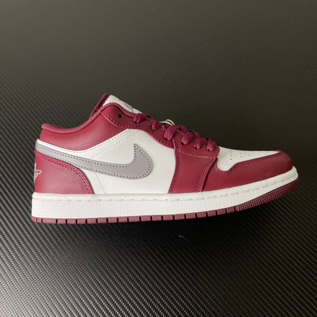 Air Jordan 1 low-top sneakers in bordeaux and white with gray swoosh and lace-up