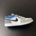 White low-top sneakers with blue collar, black swoosh, patterned heel panel