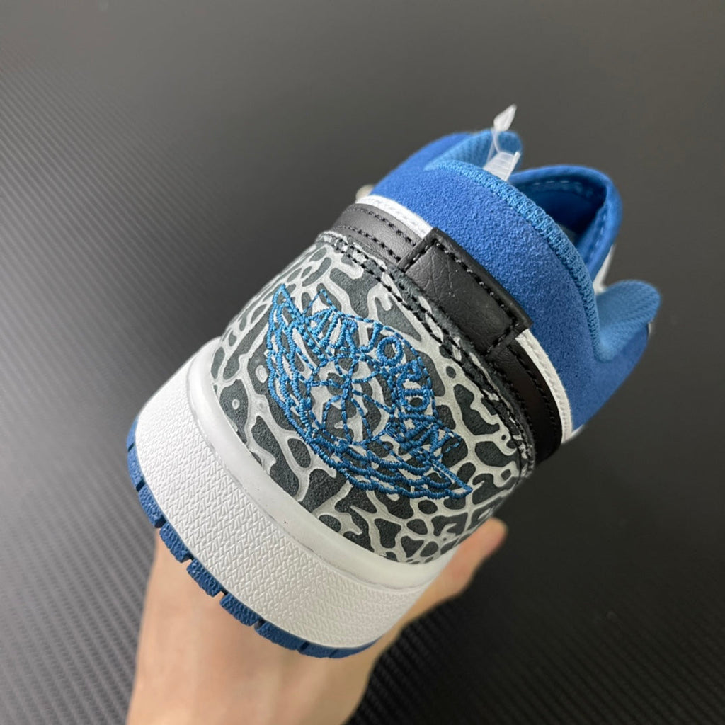 Low-top sneaker heel view with blue lining and gray-and-blue patterned panel