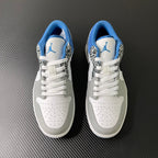 Pair of white low-top sneakers with blue interior and leopard-patterned overlays