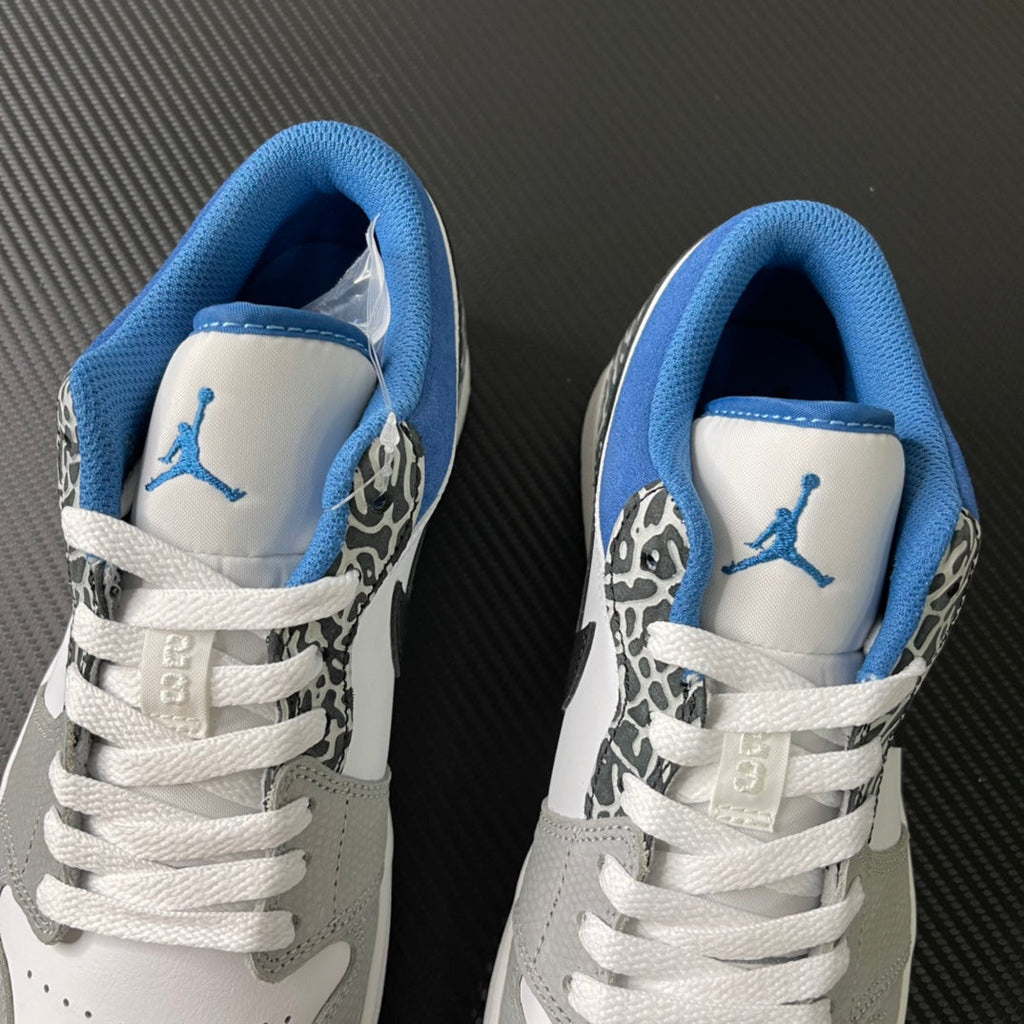 Pair of low-top sneakers with blue lining and Jumpman logo on the tongue